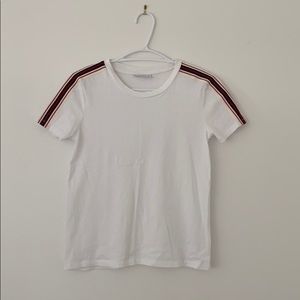 white tna top with red and blue striped sleeves